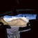 A virtual flight ride experience with a screen showing a mountain landscape with flowers in Iceland